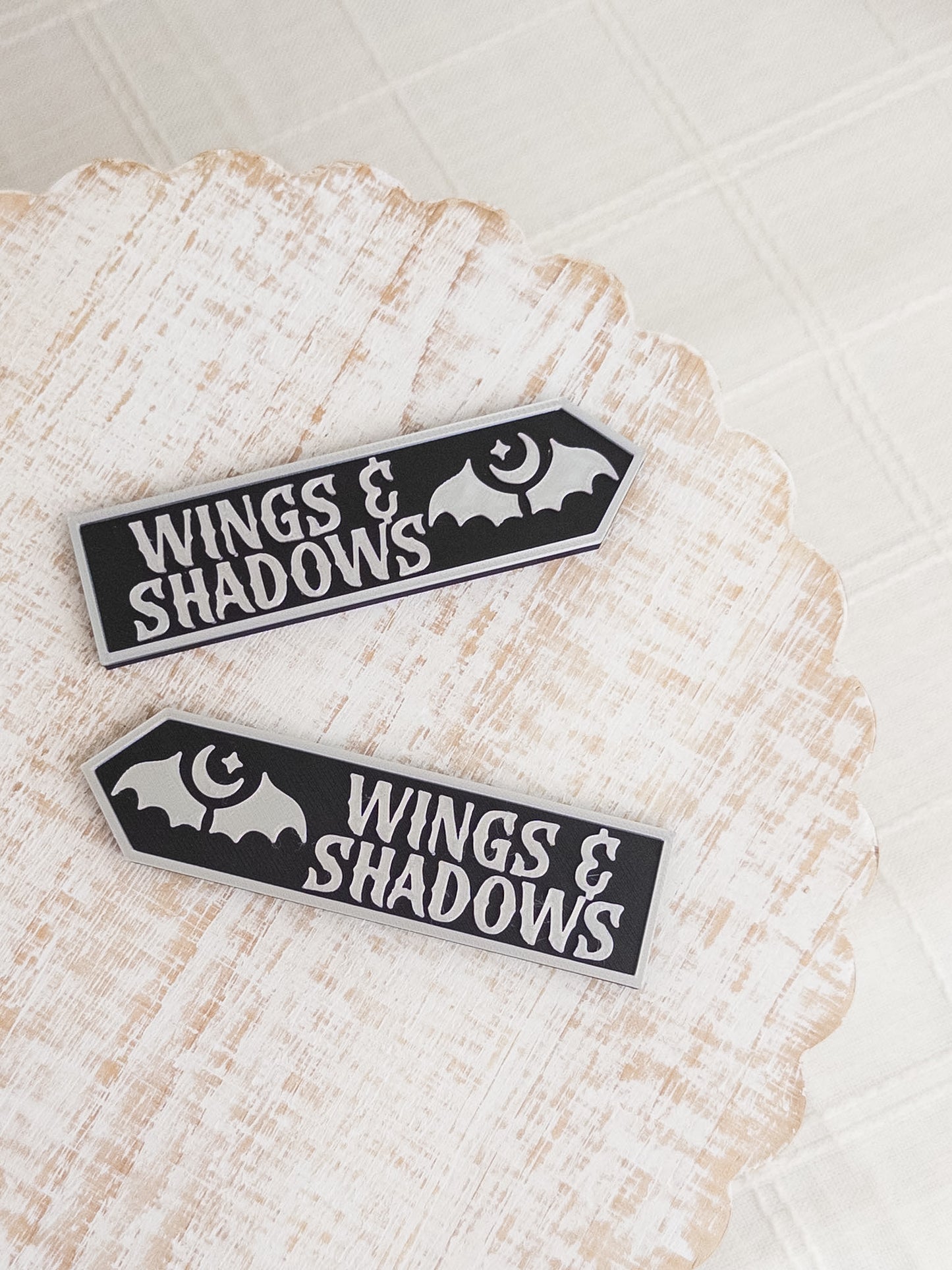 Wings & Shadows Sign