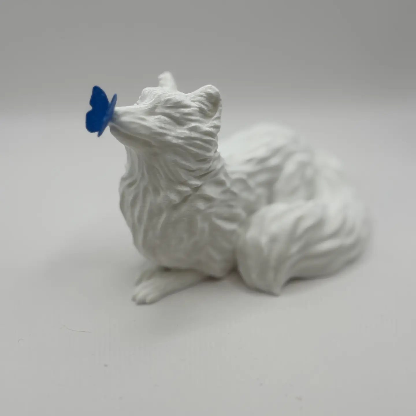 White Fox with Butterfly Figurine